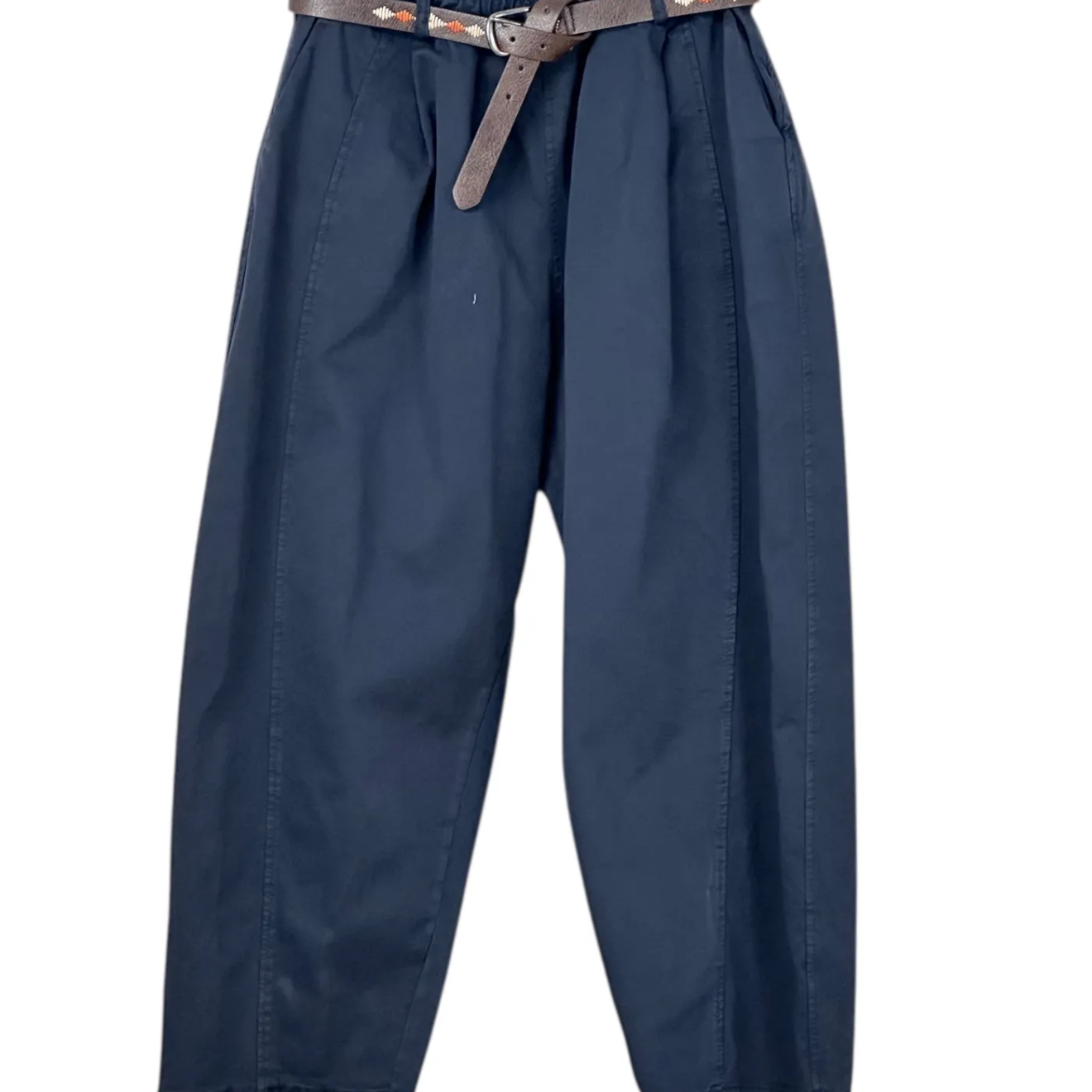 Blue pants with a belt on a hanger against a white background