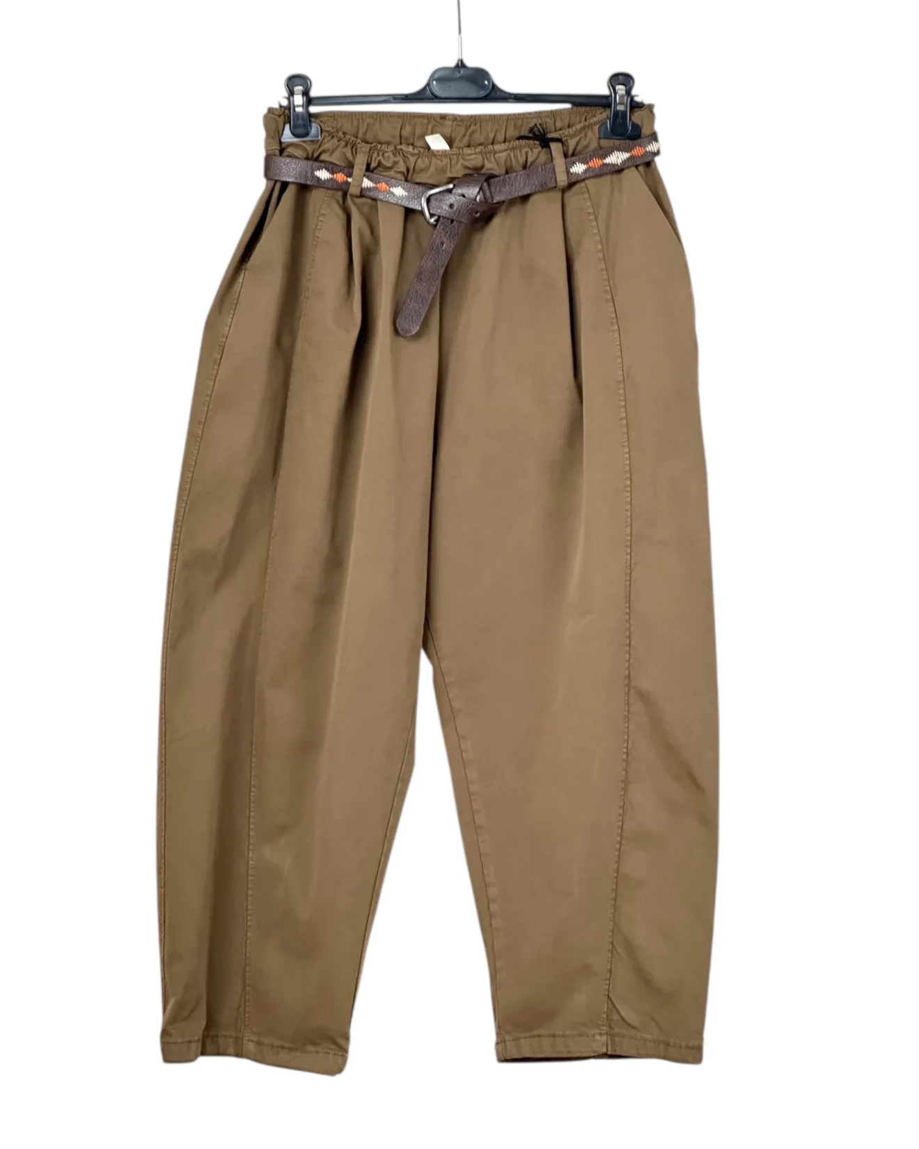 Brown pants on a hanger with a belt against a white background