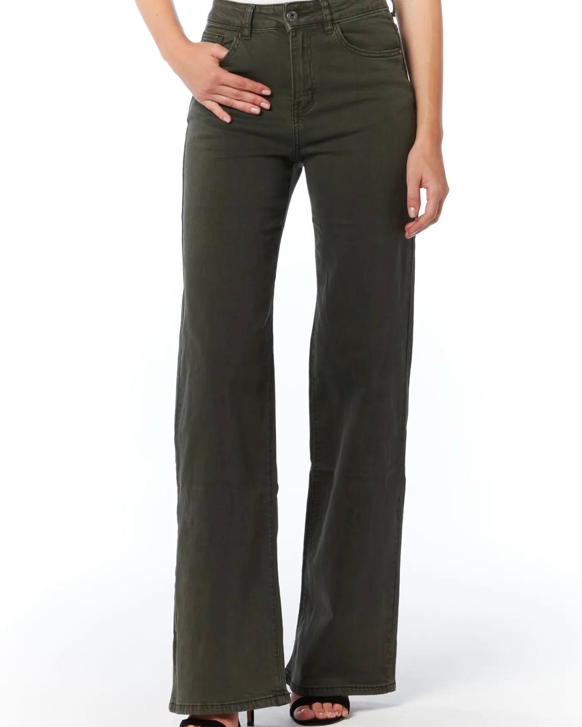 A model wearing a pair of dark olive green wide-leg jeans with a white top and black sandals, shown from the waist down against a white studio background.