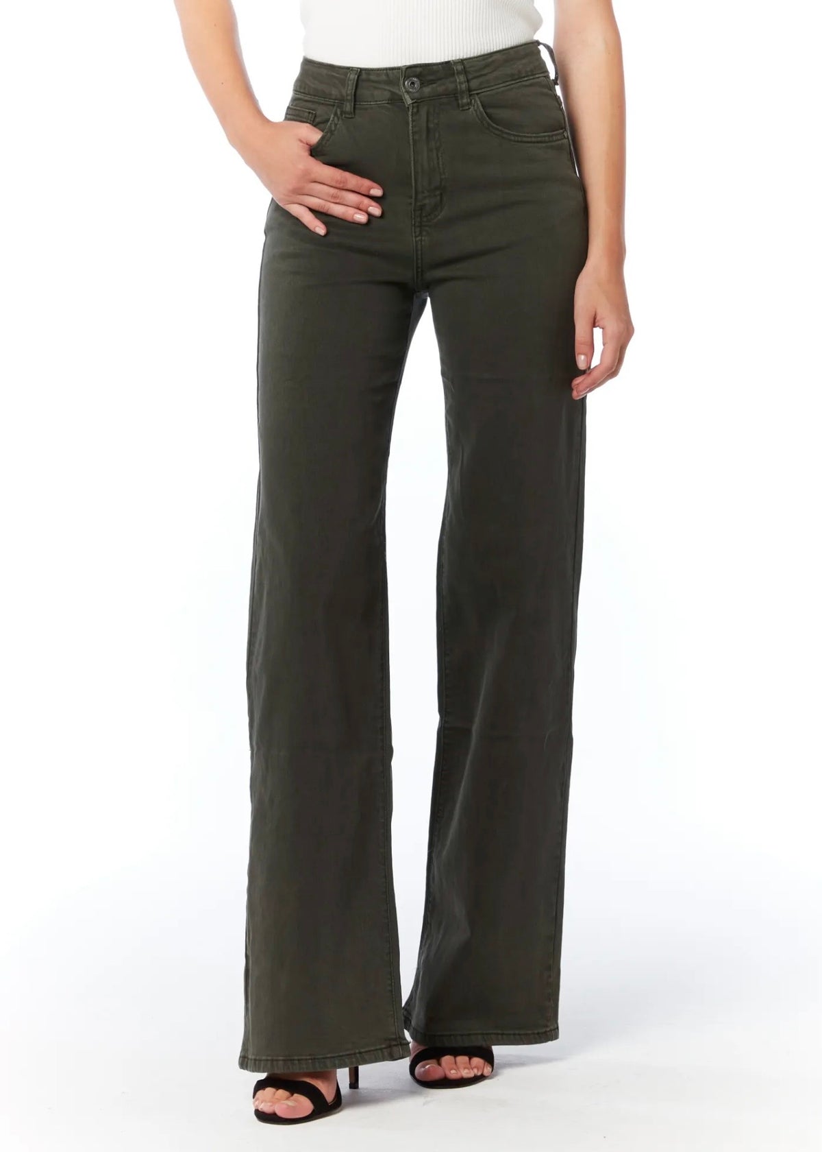 A model wearing a pair of dark olive green wide-leg jeans with a white top and black sandals, shown from the waist down against a white studio background.