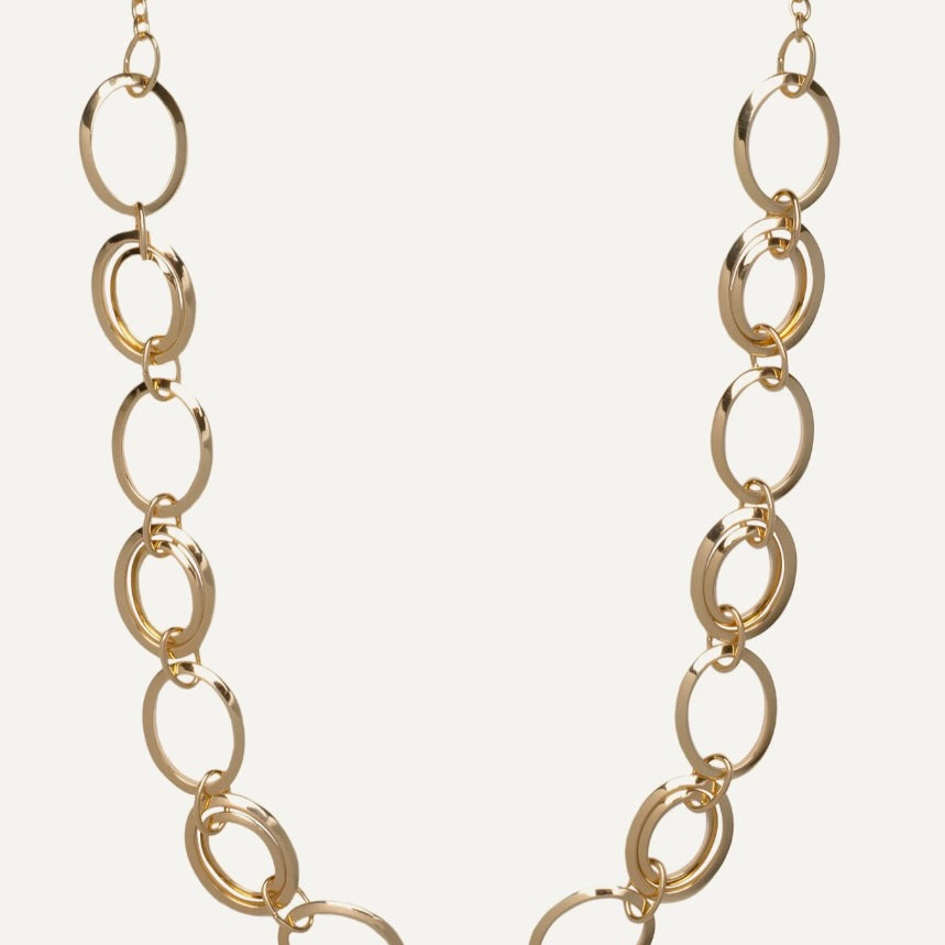 Gold chain necklace on a white background