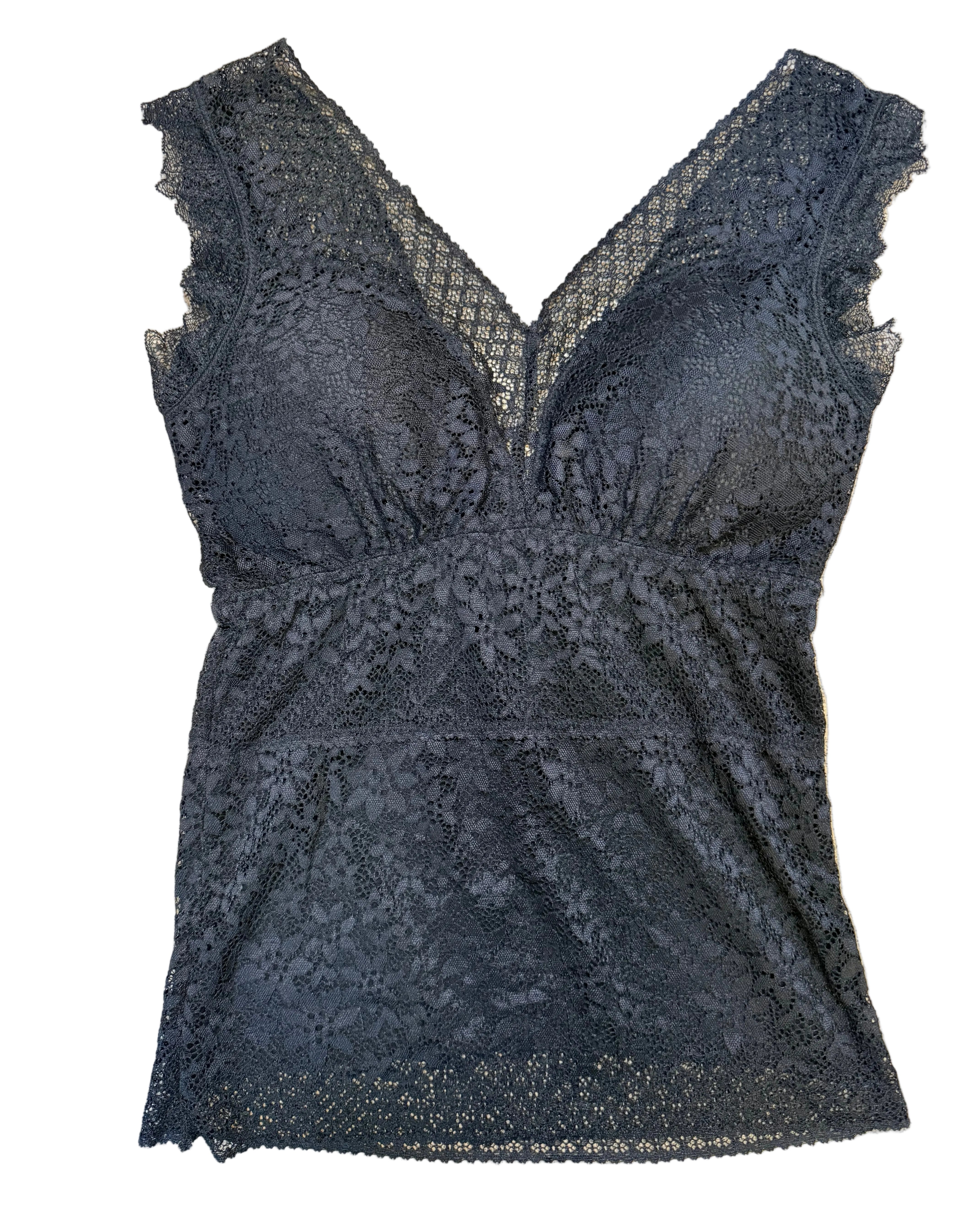 Black lace garment on a beige surface