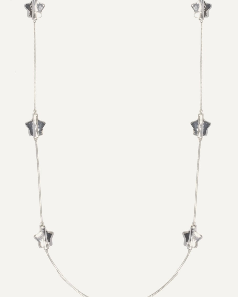 Silver necklace with star-shaped pendants on a white background