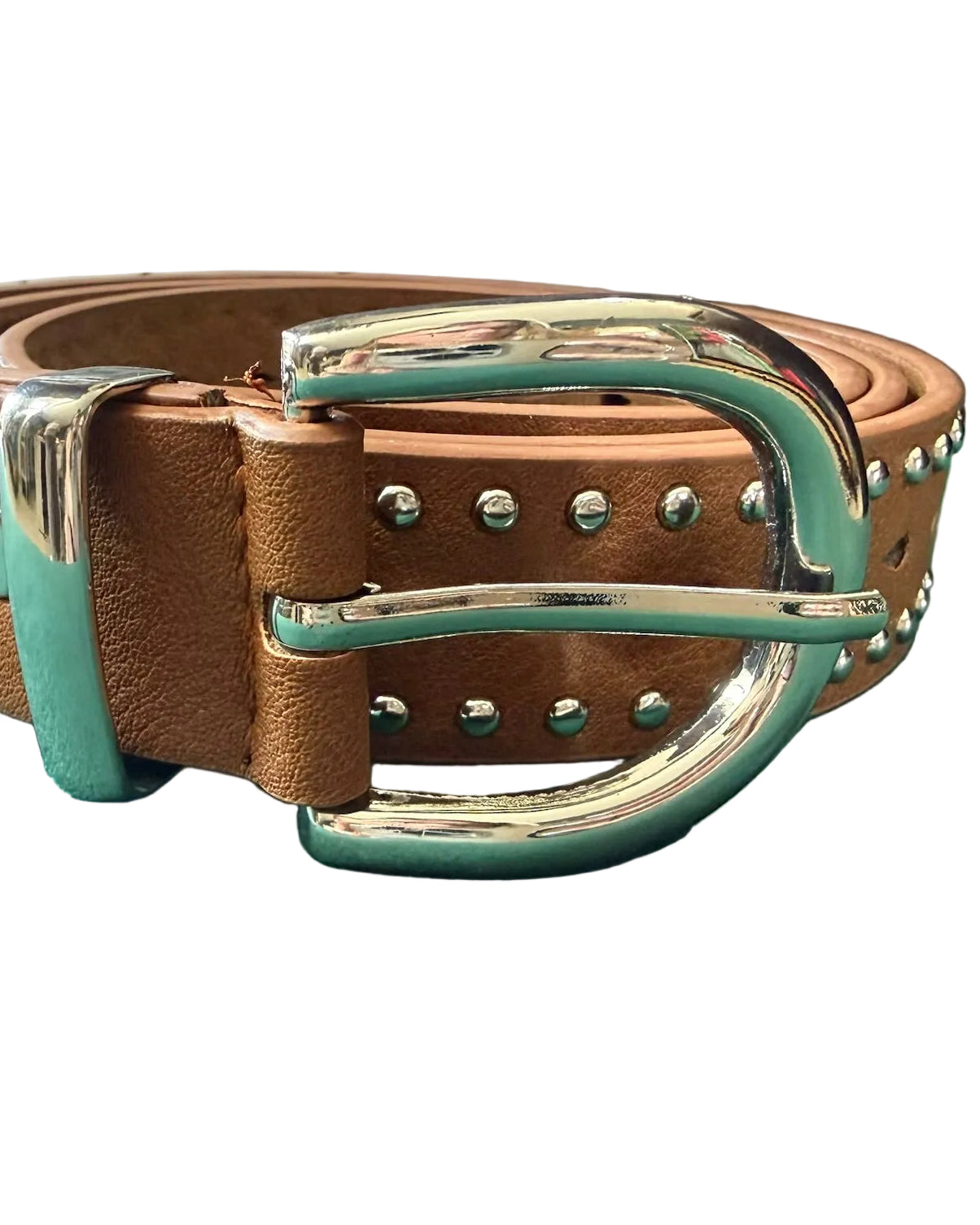 Brown leather belt with silver buckle on a green surface
