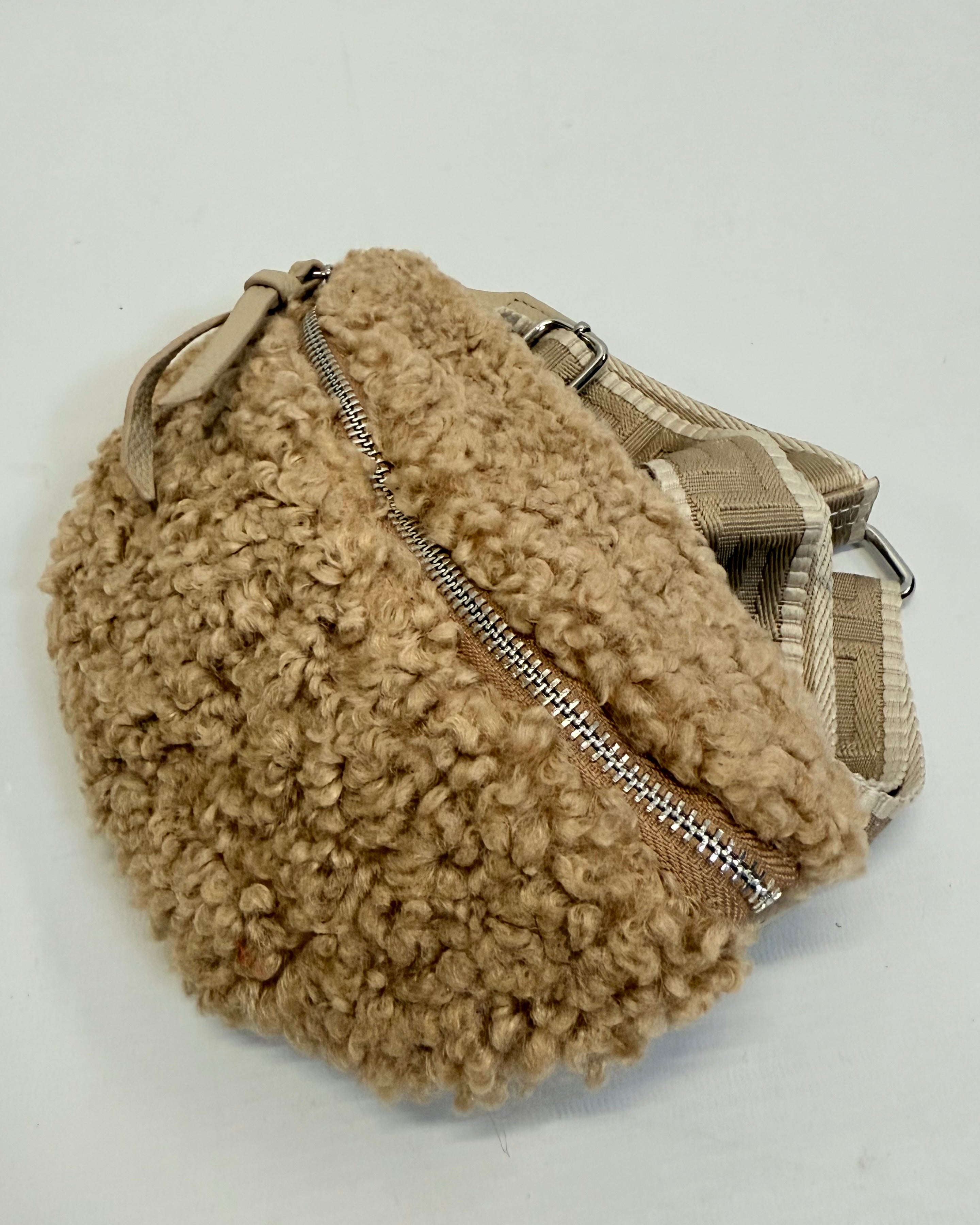 Beige fleece pouch with a zipper on a white background