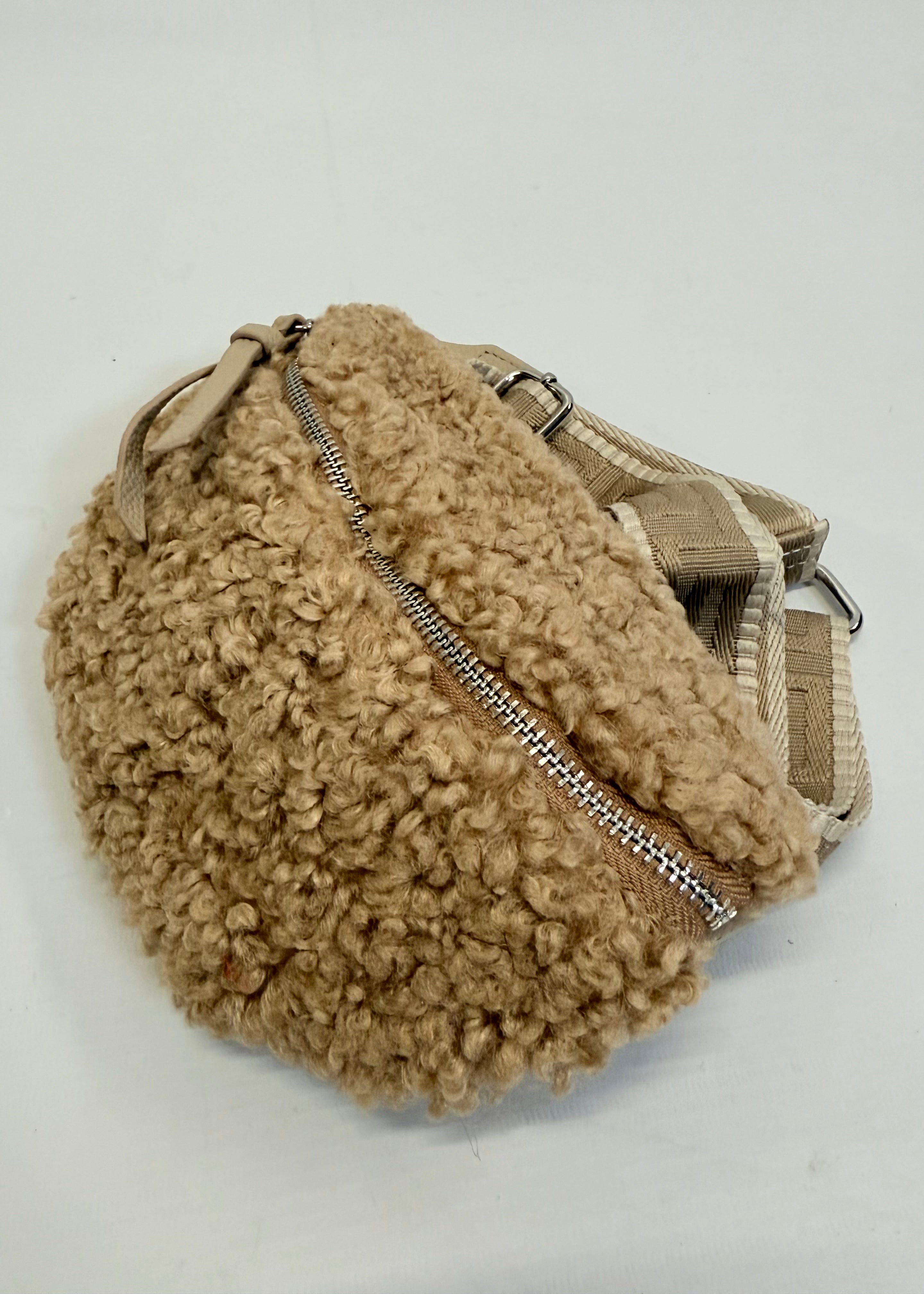 Beige fleece pouch with a zipper on a white background