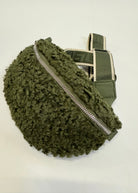 Green textured bag with a zipper on a white background