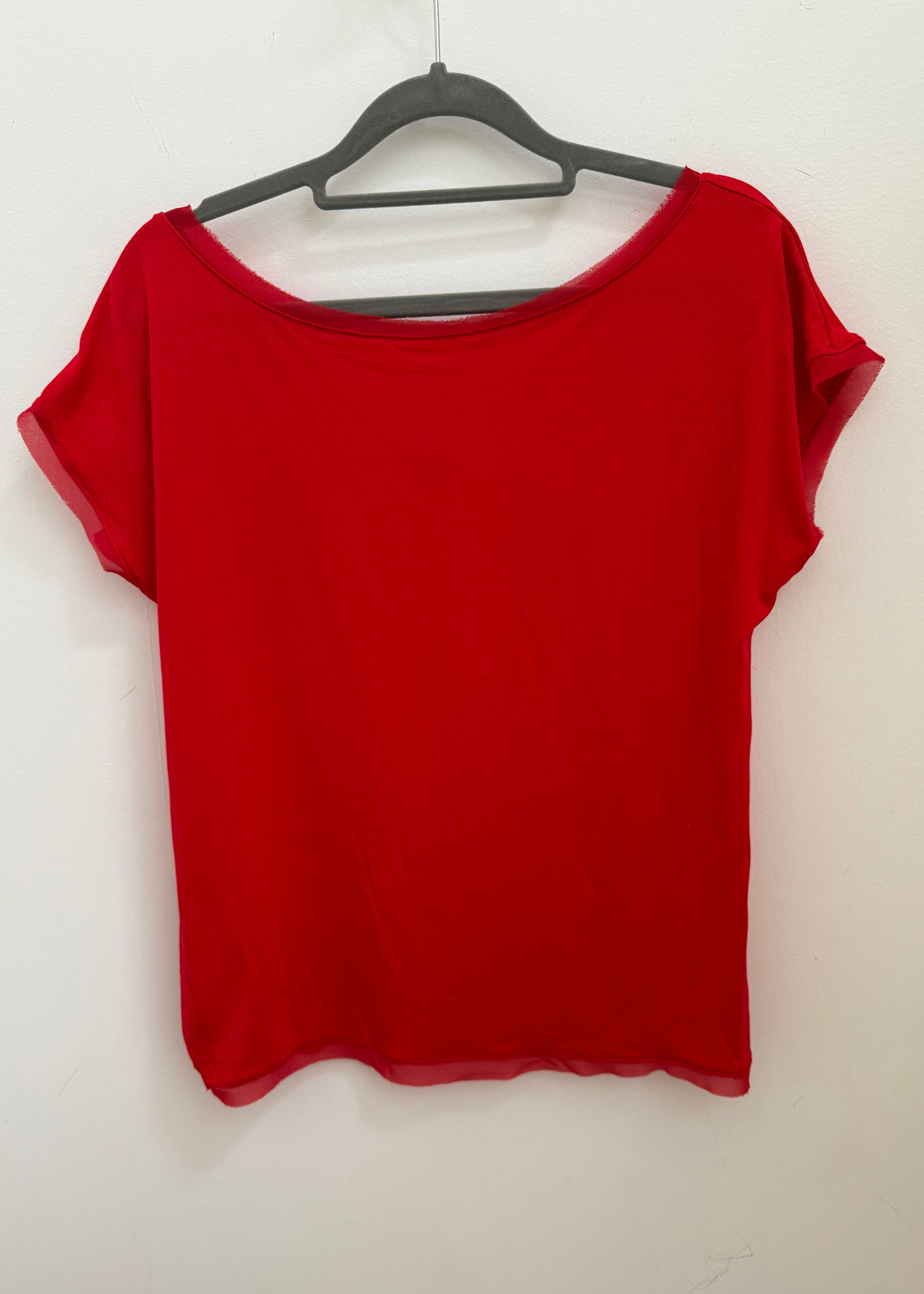 Red top on a hanger against a white background