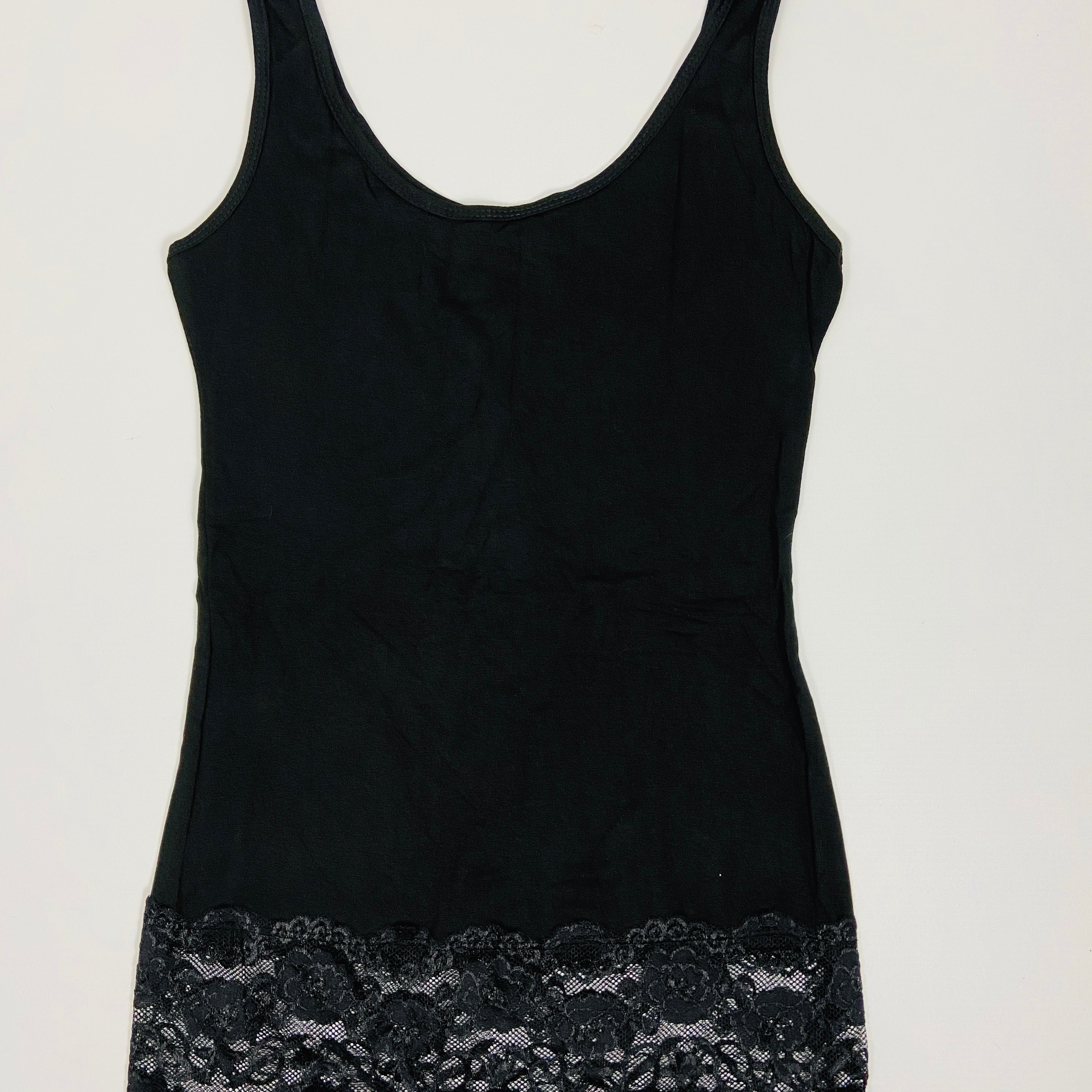 Black tank top with lace trim on a white background