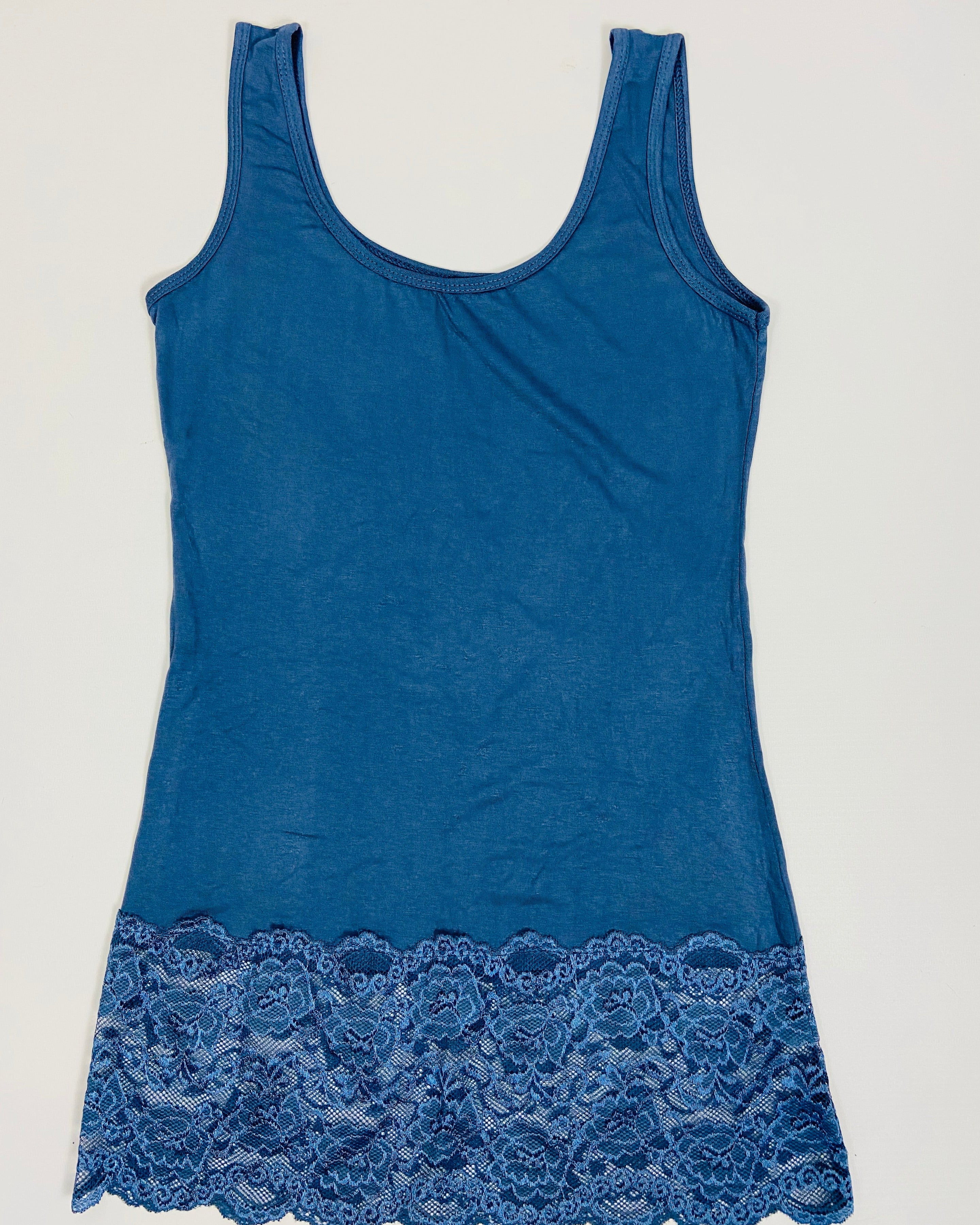 Blue tank top with lace trim on a light gray background