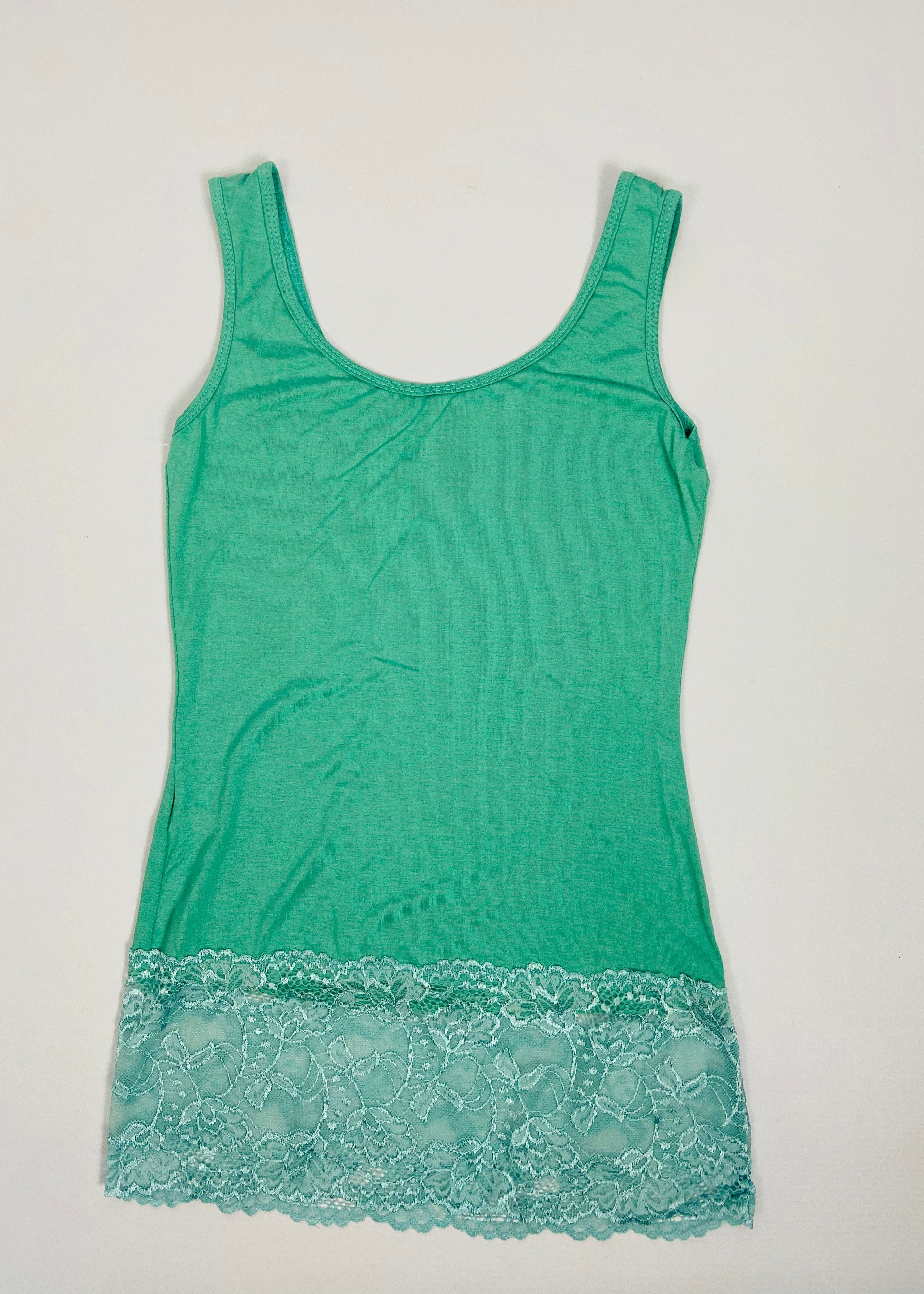 Green tank top with lace trim on a light gray background