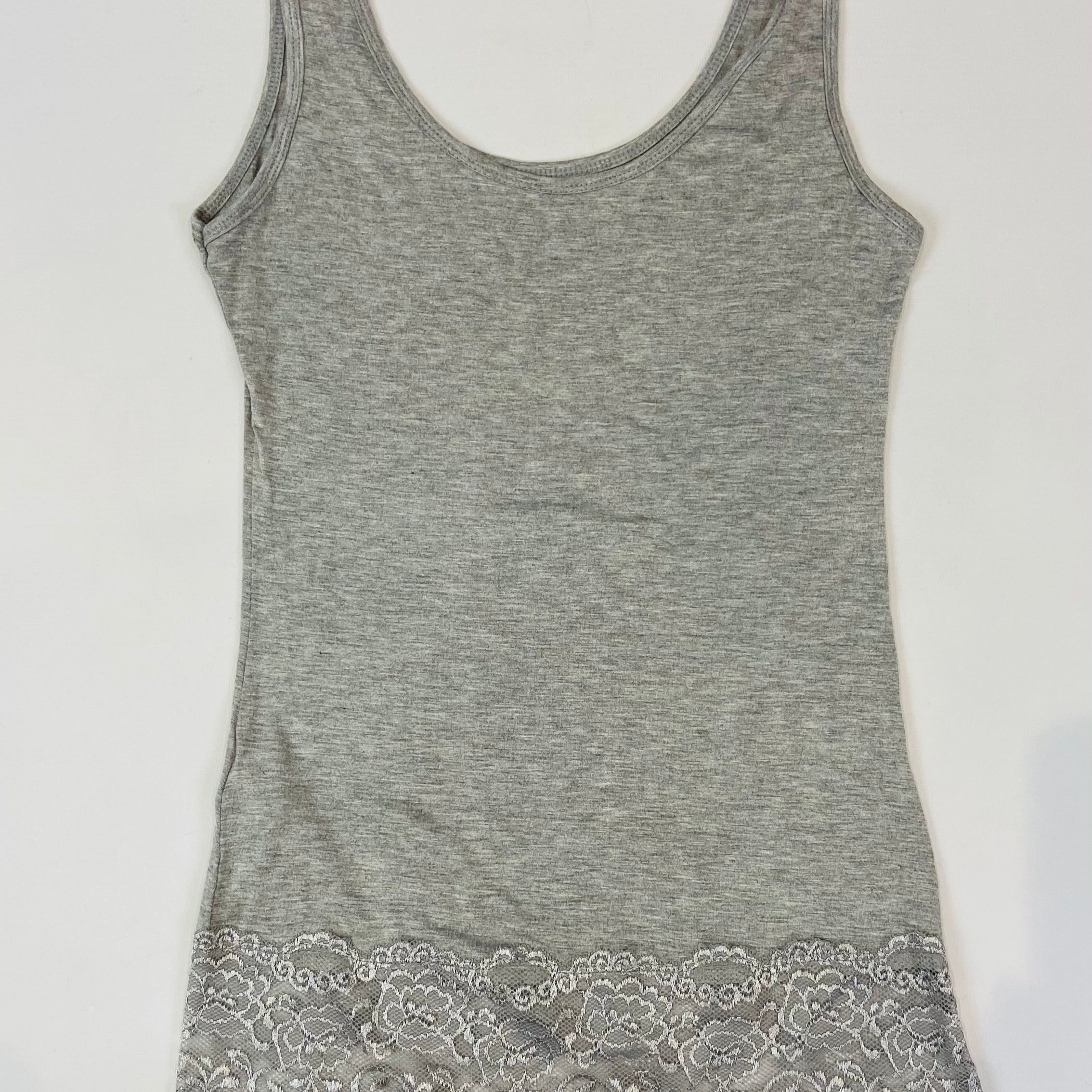 Gray tank top with lace trim on a white background