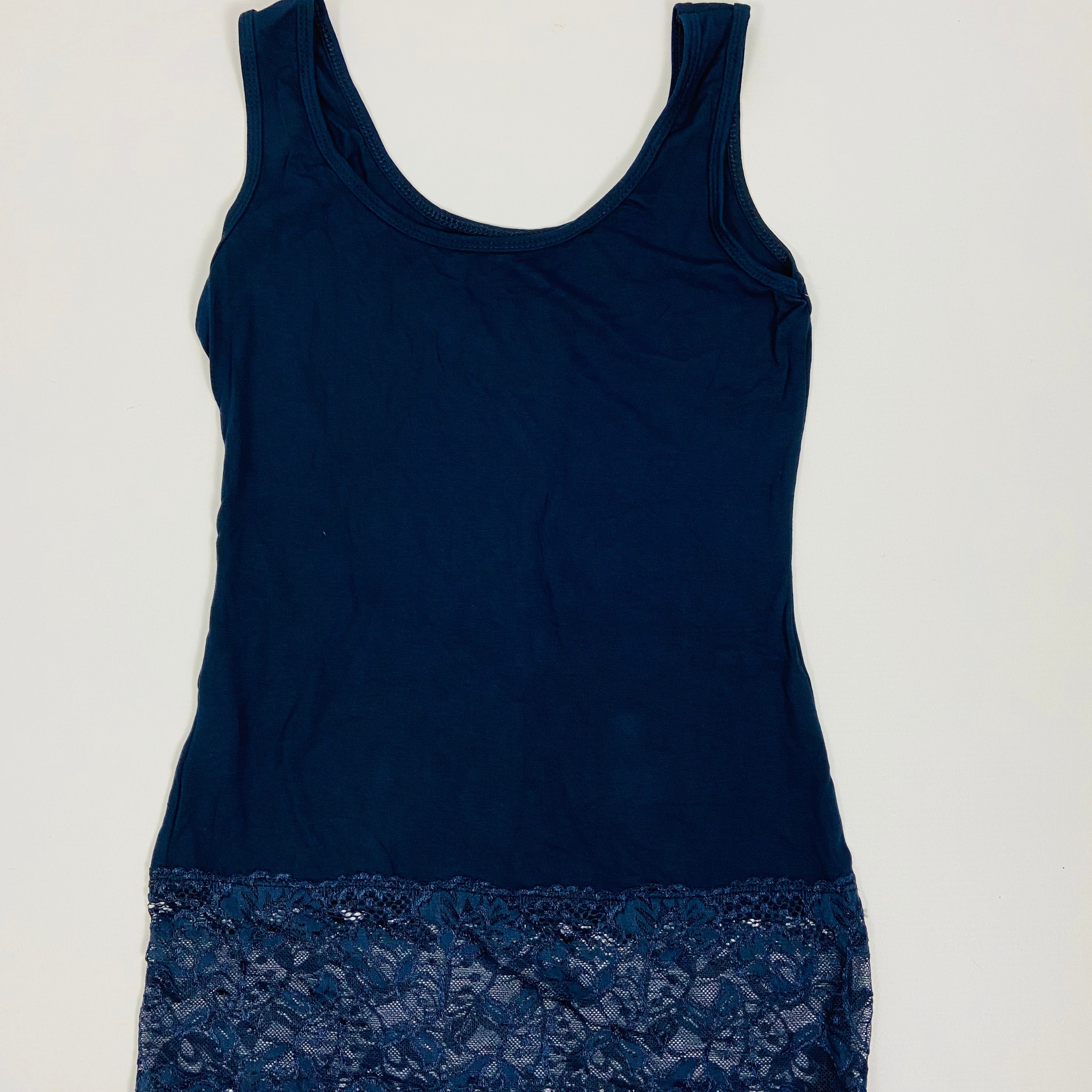 Navy blue tank top with lace trim on a white background