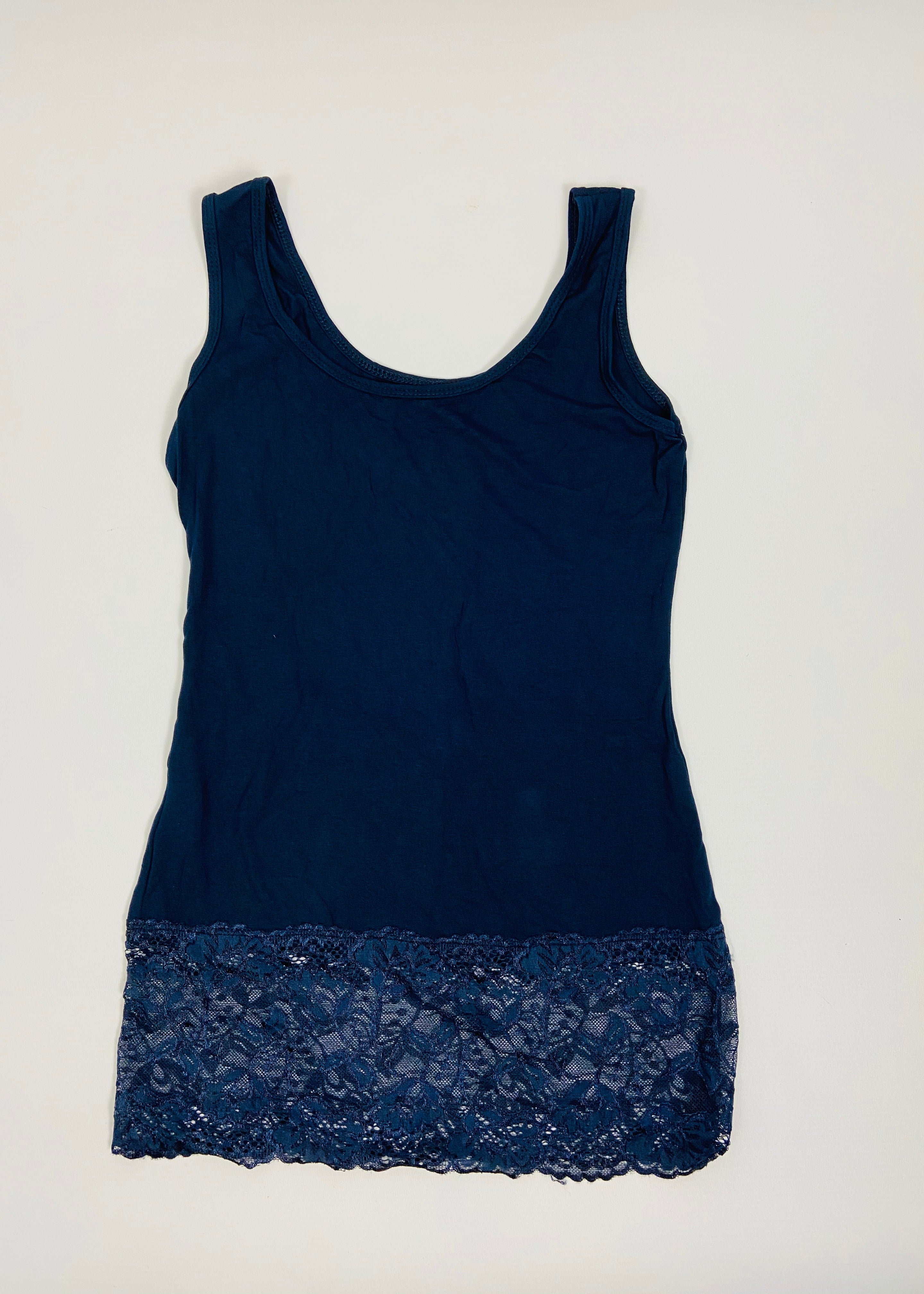 Navy blue tank top with lace trim on a white background