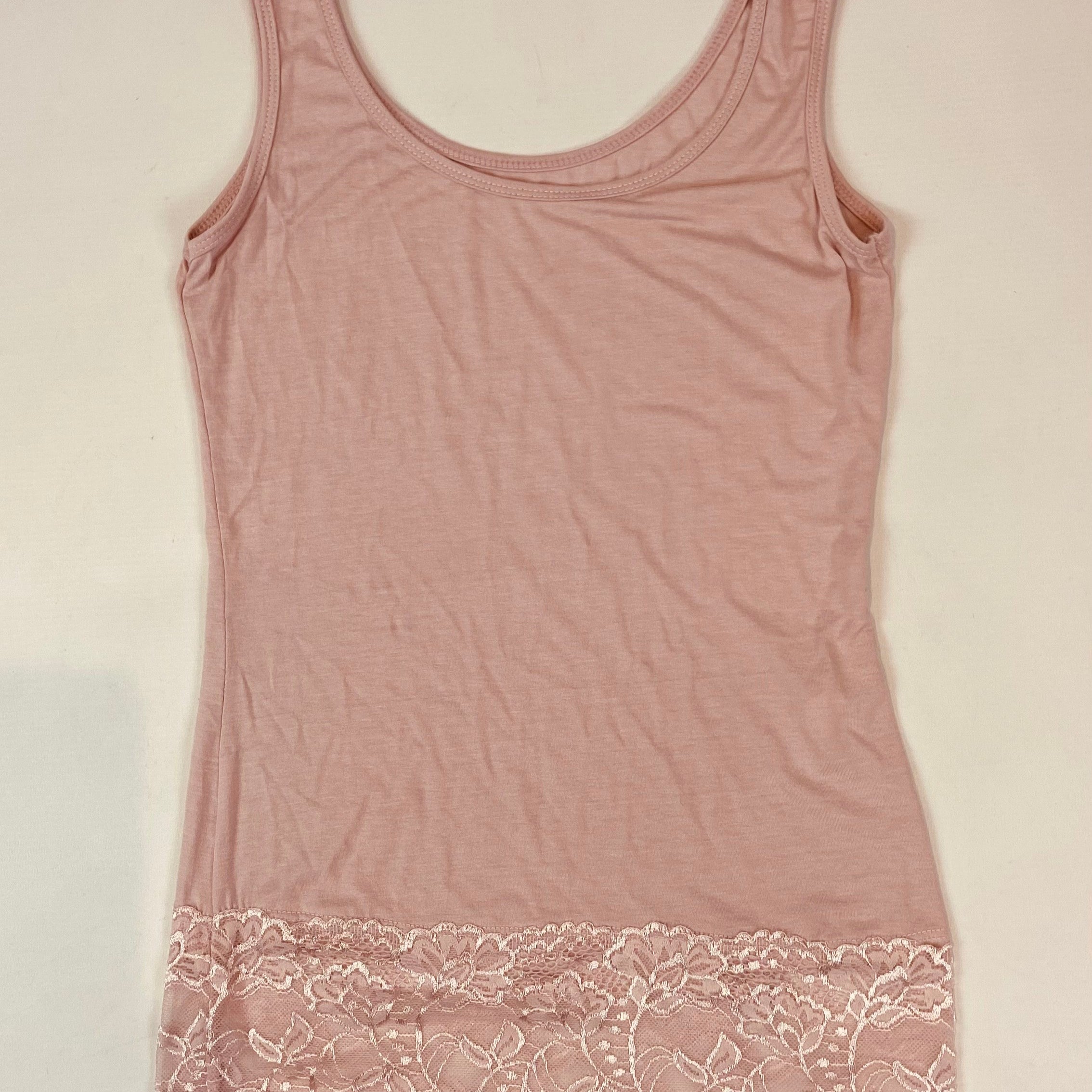 Pink tank top with lace trim on a light background