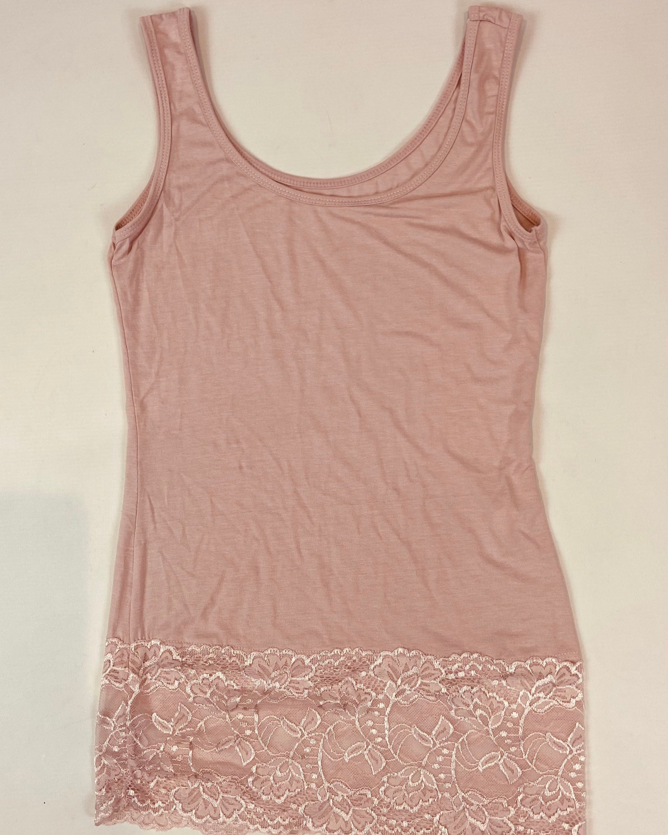Pink tank top with lace trim on a light background