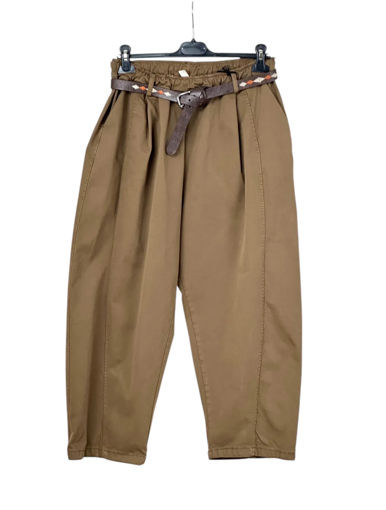 Brown pants on a hanger with a belt against a white background