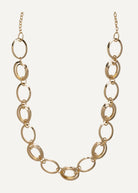 Gold chain necklace on a white background