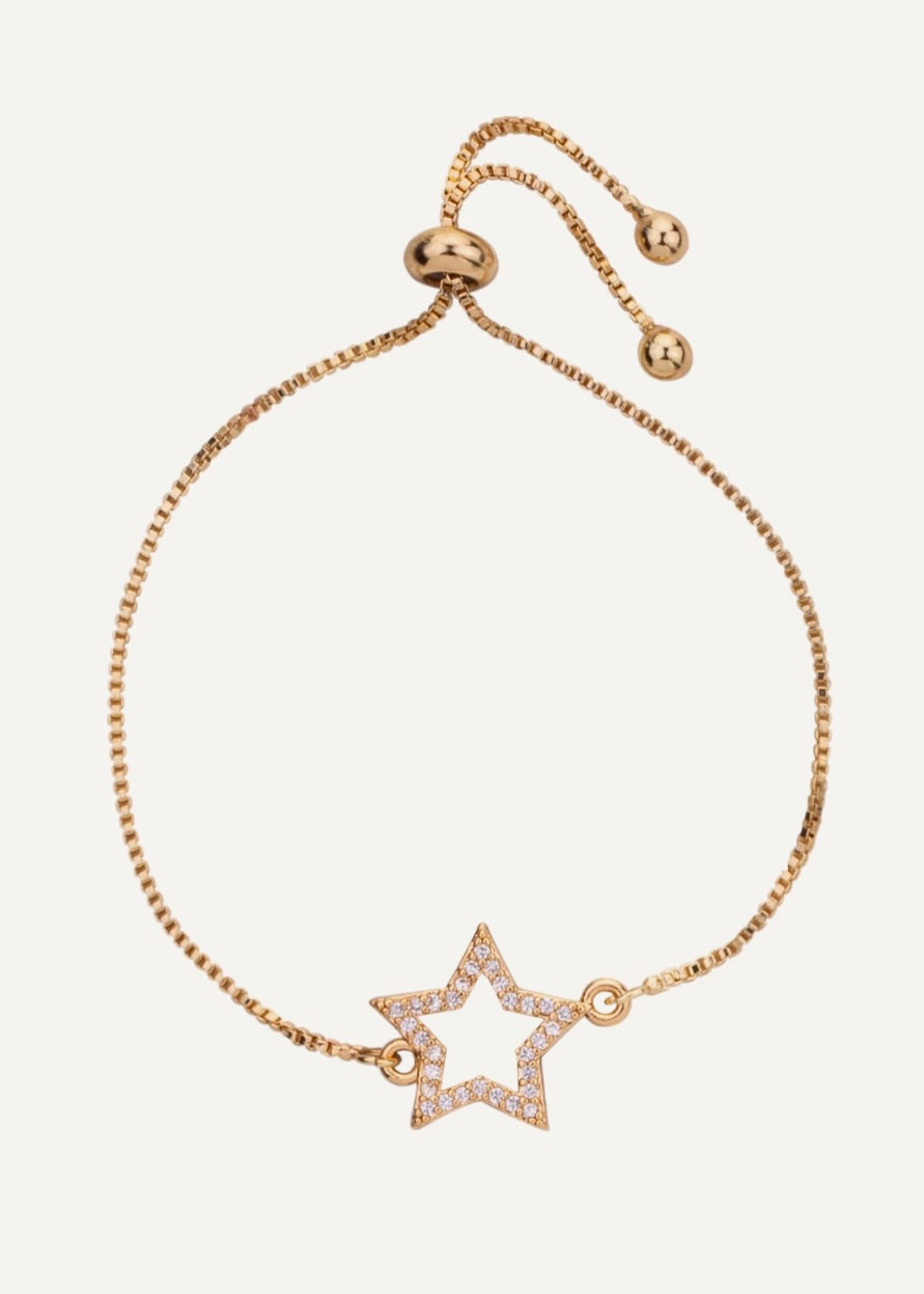 Gold bracelet with a star-shaped charm on a white background