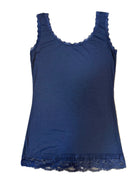 Navy blue dress with lace trim on a beige carpet