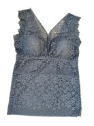 Lace lingerie set on a beige carpet
