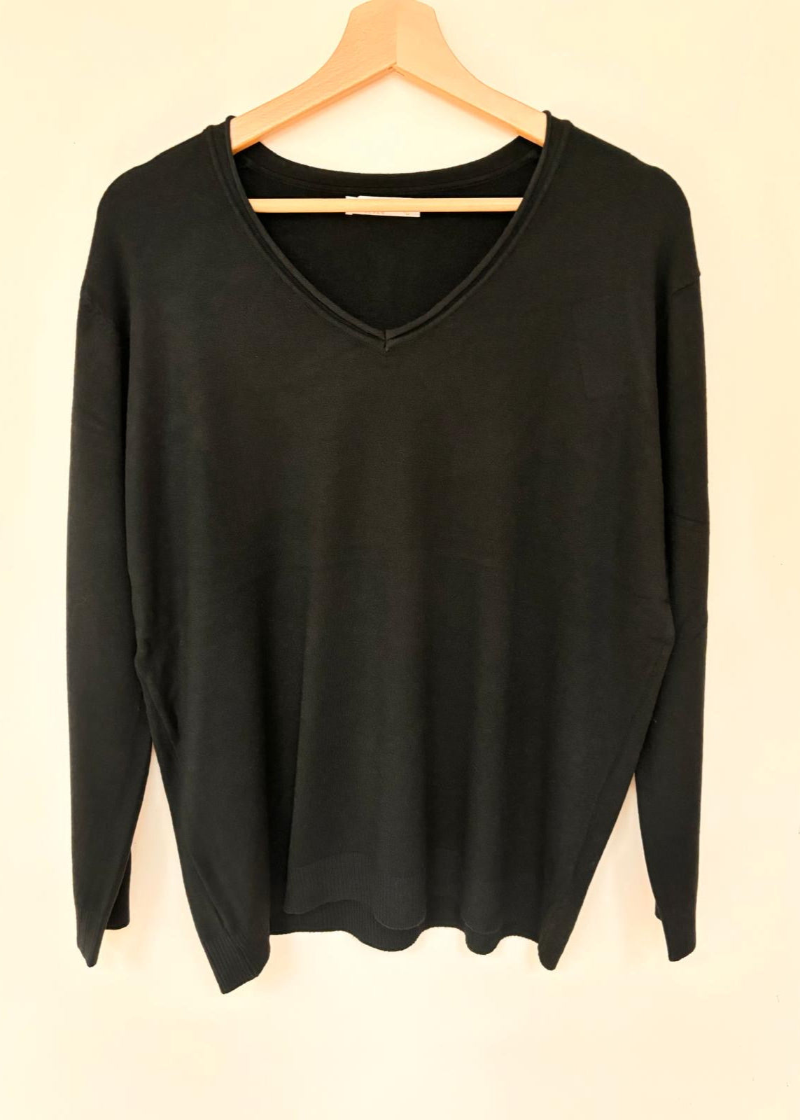 Black V-neck jumper